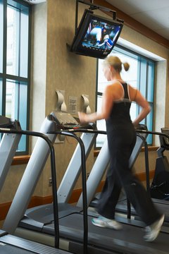 Jupiterimages/Photos.com/Getty Images High-intensity interval training can help you lose weight using the treadmill.