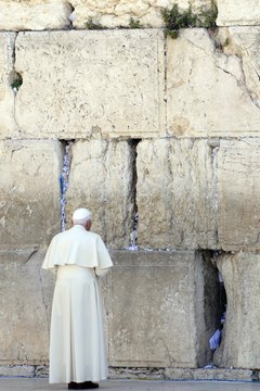 The pope prays at the Wailing Wall, one of Judaism's holiest sites.