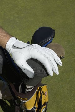 A golf glove helps a golfer grip the club while protecting against blisters.