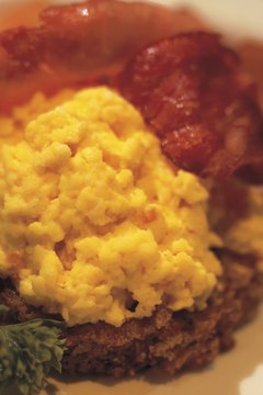 Stockbyte/Stockbyte/Getty Images Eggs are an excellent source of protein, but high in cholesterol.