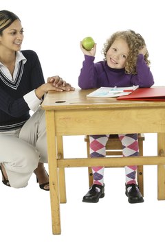 Photos.com/PhotoObjects.net/Getty Images Teachers provide instruction and guidance to children.