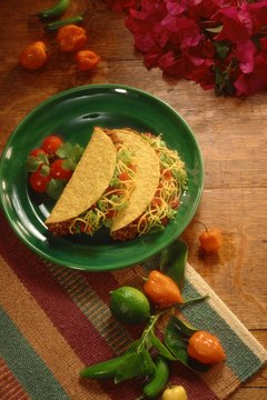 Jupiterimages/Comstock/Getty Images Tacos can be healthy or fattening, depending on what's in them.