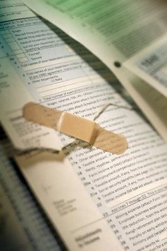 Jupiterimages/Photos.com/Getty Images Wise investment choices can help you stop the financial bleeding at tax time.