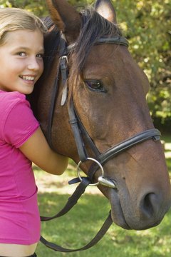 Jupiterimages/Pixland/Getty Images Donating your horse to a nonprofit can bring joy to kids who need it.