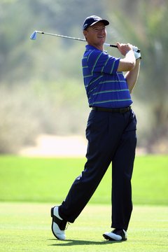 Swing easy and hit hard using less arm effort during a golf shot.