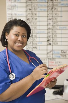 Jupiterimages/Creatas/Getty Images LVNs help update patients' records for physicians to review.