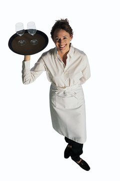 Comstock/Comstock/Getty Images Some restaurant employees gain experience as bussers before becoming servers.
