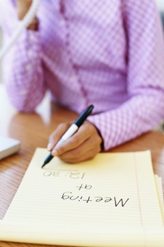 Stockbyte/Stockbyte/Getty Images Send co-workers a memo to invite them to attend next week's staff meeting.