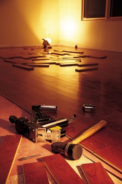 Comstock/Comstock/Getty Images Take the best pieces of wood and prepare them for use as new flooring or as something else.