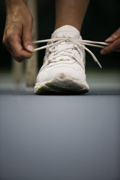 Jupiterimages/Photos.com/Getty Images Wear the right athletic shoes to prevent sore calves.