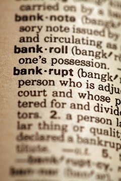 Jupiterimages/Photos.com/Getty Images Filing bankruptcy is one option for dealing with unpaid debt.