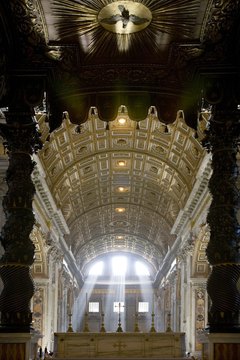 Light streaming through three windows of St. Peter's Basilica evokes the Trinity.