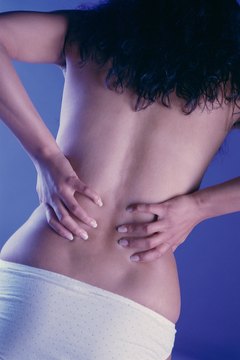 Stockbyte/Stockbyte/Getty Images A sore lower back is common to all golfers.