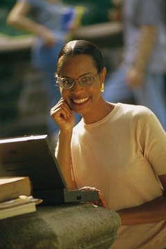 Comstock/Comstock/Getty Images Grading online makes use of a teaching certificate, and you can work from home.