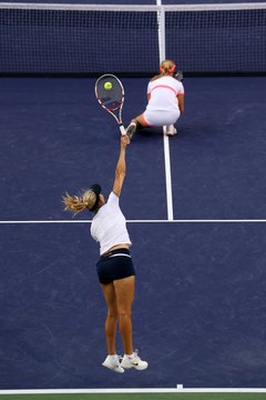 Stephen Dunn/Getty Images Sport/Getty Images Your serve is a fault if it hits your partner.
