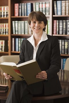 Jupiterimages/Comstock/Getty Images Paralegal consultants perform standard legal services on an as-needed basis.