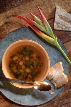 Jupiterimages/Comstock/Getty Images Vegetable soup is hearty, healthy and inexpensive to make.