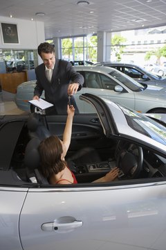 Polka Dot Images/Polka Dot/Getty Images Don't leave the dealership without finalizing your loan.