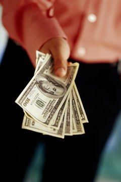 Hand with American dollars