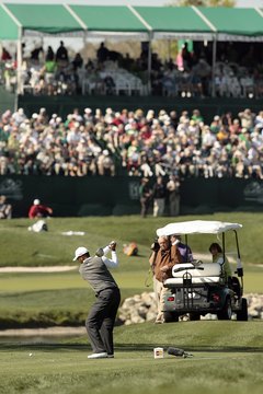 Tiger Woods turns his back to the target as he tees off during the 2007 Arnold Palmer Invitational.