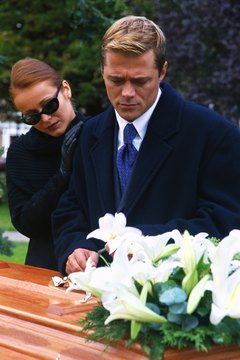 Stockbyte/Stockbyte/Getty Images Morticians help families with the difficult duty of planning funerals.