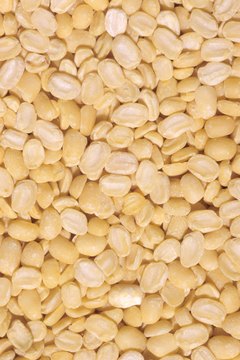 Hemera Technologies/AbleStock.com/Getty Images Peanuts are healthier without the yogurt coating.