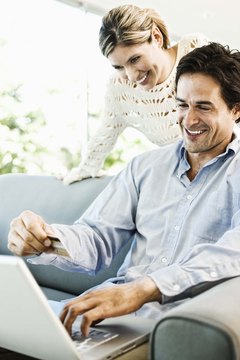 Jupiterimages/Brand X Pictures/Getty Images Credit cards mean more opportunities for online shopping.