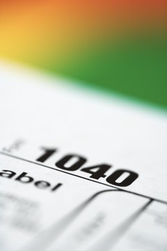 Thinkstock/Comstock/Getty Images Contributing to an IRA may reduce your federal taxes.