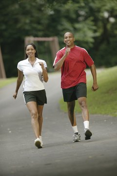 Comstock/Comstock/Getty Images Recruit a friend to make your 26-mile walk more enjoyable