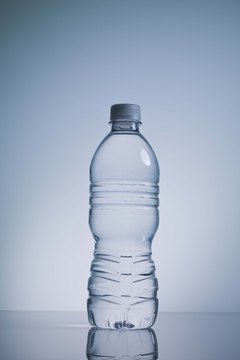 Jupiterimages/Comstock/Getty Images A simple water bottle filled with sand or rocks can substitute for a dumbbell.