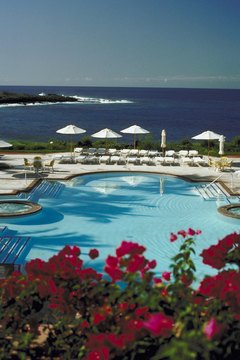 Resort swimming pool by ocean in Hawaii