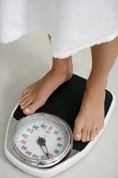 Goodshoot/Goodshoot/Getty Images Eating 1,000 calories daily may help the numbers on the scale go down.