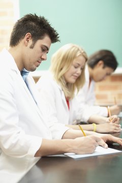 Jack Hollingsworth/Photodisc/Getty Images Becoming an RN requires passing different exams.