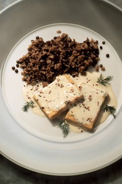 Eising/Photodisc/Getty Images Tofu is a lean, healthy protein source.