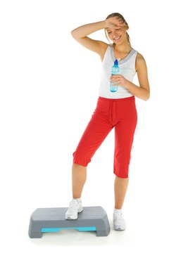 Jupiterimages/Photos.com/Getty Images Get your aerobic fix on the stepper platform.