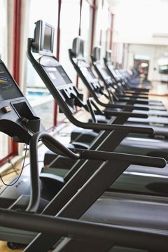 Jupiterimages/Brand X Pictures/Getty Images Treadmills may be great for the heart but use can injure your spine.