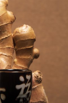 Brand X Pictures/Brand X Pictures/Getty Images Ginger tea can help help relieve pain, nausea and inflammation.