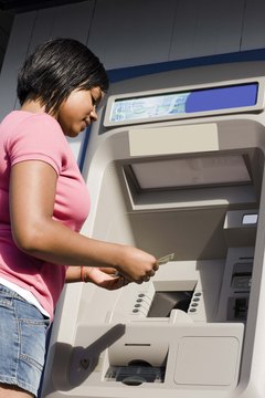 Jupiterimages/Creatas/Getty Images ATMs are efficient machines, but do have some disadvantages.