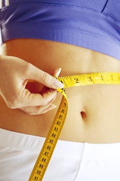 Brand X Pictures/Brand X Pictures/Getty Images Drinking water, sleeping soundly, eating right and exercising each play a factor in decreasing belly fat.