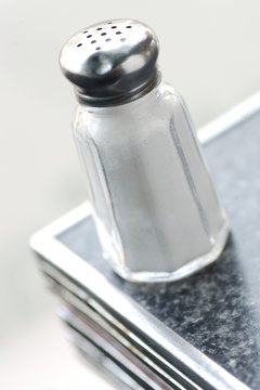 Hemera Technologies/AbleStock.com/Getty Images Keep sodium intake within the desired daily range to prevent adverse health effects.
