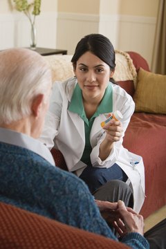 Jupiterimages/Comstock/Getty Images Medication aides work in long-term care facilities, hospitals and medical centers.
