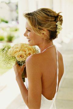 Digital Vision./Digital Vision/Getty Images Turn heads on your big day by looking sexy and fit in your dress.