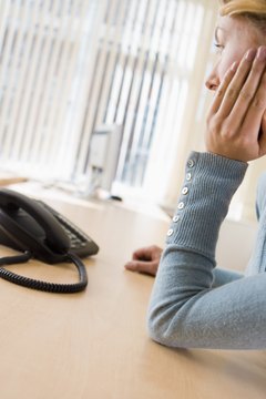 Jupiterimages/Polka Dot/Getty Images Deciding to call an ethics hotline can be stressful if you worry about retaliation.