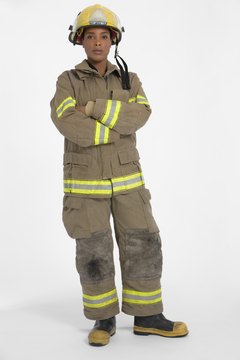 Jupiterimages/Creatas/Getty Images Firemen wear protective gear to protect them in dangerous environments.