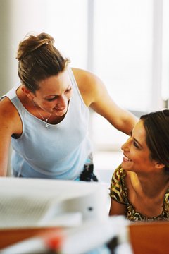 George Doyle/Stockbyte/Getty Images Ensure you portray your friend in a professional light when writing a reference for her.