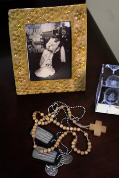 Contemporary soldiers add religious medals and prayer beads to their dog tags.
