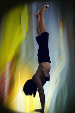 Nisian Hughes/Photodisc/Getty Images The handstand position develops arm and shoulder strength.