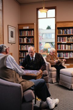Keith Brofsky/Photodisc/Getty Images Assisted living facilities are not covered by Medicare. Assisted living insurance can cover some of the costs.