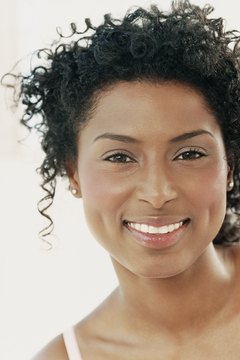 Digital Vision./Photodisc/Getty Images Proper nutrition keeps your cheeks glowing.