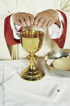The priest will lead the blessing of the Eucharist.